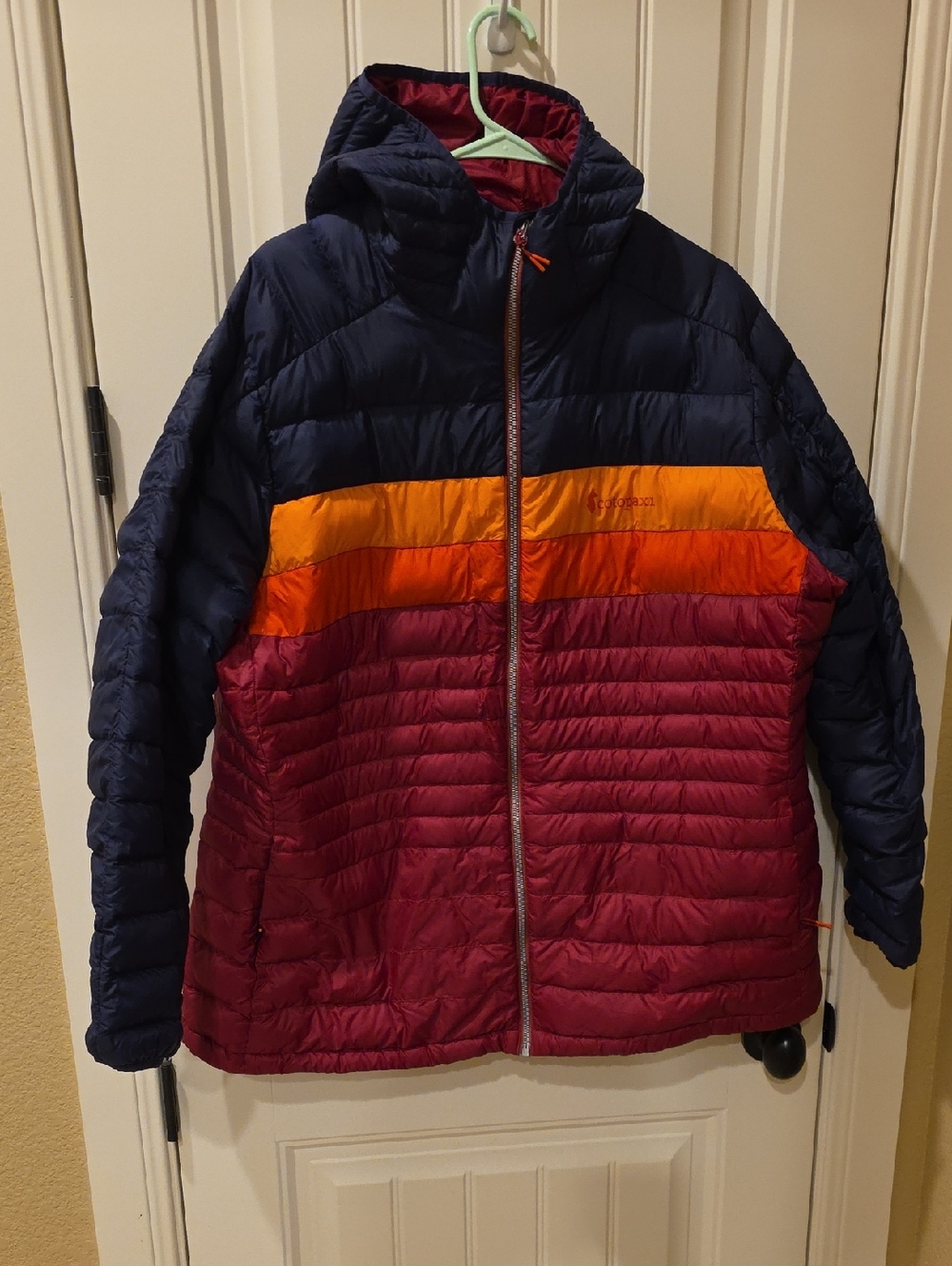 Cotopaxi Fuego Down Hooded Jacket in Navy, Yellow, Orange, Burgundy